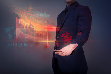  Businessman is analyzing economic data  falling due to the coronavirus (Covid-19) pandemic crisis, World Economic crisis concept