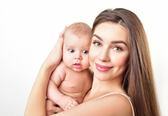 Mother and baby playing and smiling. Happy family.