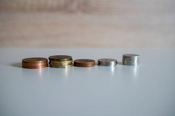 stack of coins on a white background