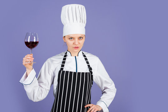 perfect burgundy beverage. cook drink alcohol. sommelier with red cabernet or merlot. Restaurant beverage concept. cook degusting wine. wine culture. woman hold wineglass in restaurant