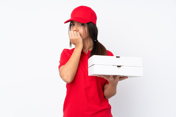 Young Pizza delivery girl over isolated white background having doubts