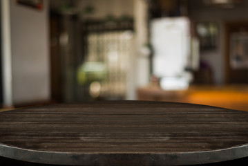 Fototapeta na wymiar Empty old wood table top with bokeh coffee shop interior background