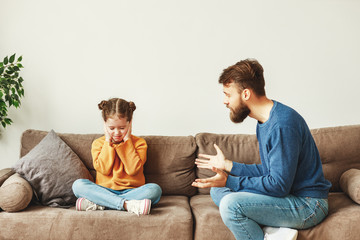Father talking with naughty daughter.