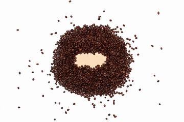 scattered coffee beans in the shape of a circle. coffee beans are scattered in a circle on a white background. Coffee pot with empty space for lettering, text, or logo