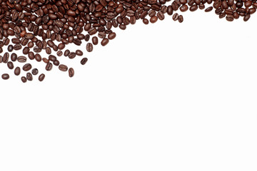 fried brown coffee beans are sprinkled on top. coffee abstraction on a white background. brown coffee bean background or texture