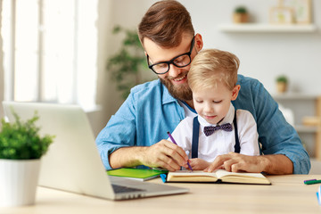 Fototapeta premium Father helping son with homework.