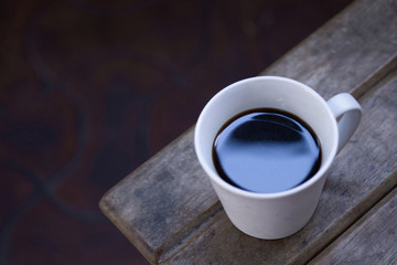 Cup of coffee top view, black coffee overhead view
