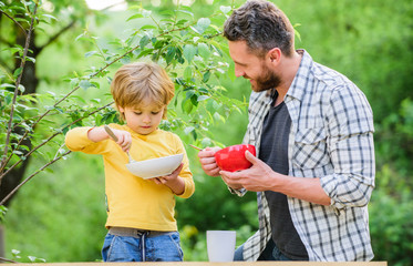 Happy family together. childhood happiness. Baby food. healthy food and dieting. Choose a healthy lifestyle. happy fathers day. Little boy with dad have breakfast. son and father eating milk porridge