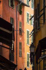 Fototapeta na wymiar Nice, France - April 2017: a narrow and alleyway in Nice's Old City