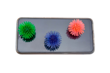 Smartphone with 3D models of coronavirus on display, isolated on white background. The concept of the need for regular disinfection of household appliances and gadgets.