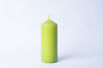 green candle on a white background