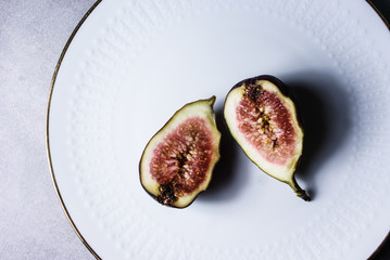 fresh figs cut half on a plate