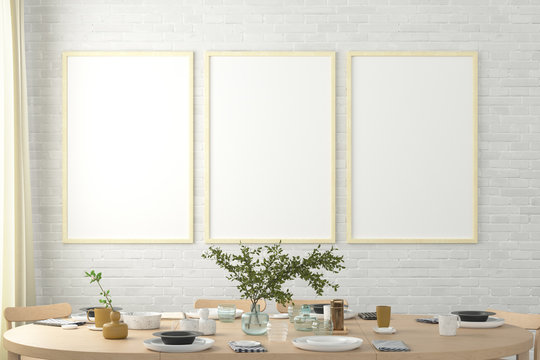Three vertical blank posters on white brick wall in interior of modern dining room. Clipping path around poster. 3d illustration