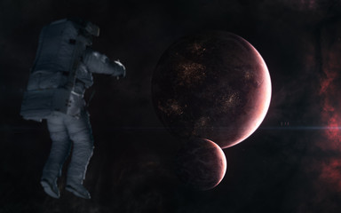Astronaut on background of inhabited planets in red light. Deep space. Science fiction. Elements of...