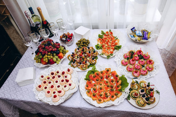 A festive table awaits guests. A variety of salads and cold dishes.