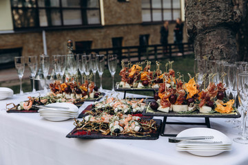 A festive table awaits guests. A variety of salads and cold dishes.