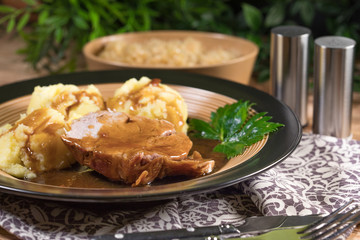 Braised pork neck in own sauce. Shallow depth of field.