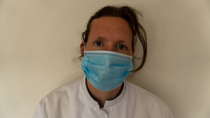 Nurse looking at camera with face mask on