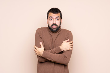 Man over isolated background freezing