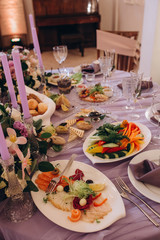 A festive table awaits guests. A variety of salads and cold dishes.