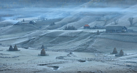 Frosty autumn morning in the village of shepherds Fundatura Ponorolui, Transilvania, Romania. Rural...