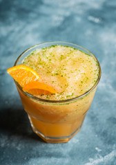 Old fashioned orange cocktail on rustic background. Selective focus. Shallow depth of field.