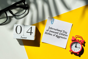 International Day of Innocent Children Victims of Aggression 04 fourth june Month Calendar Concept on Wooden Blocks.