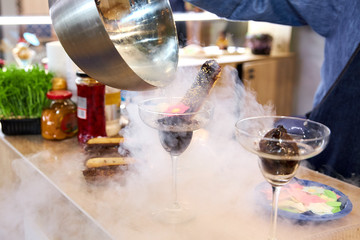 Confectioner Pours Chocolate Eclair With Liquid Nitrogen