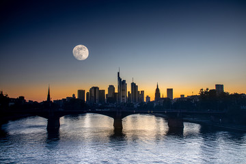 full moon and sunset with the frankfurt skyline - obrazy, fototapety, plakaty