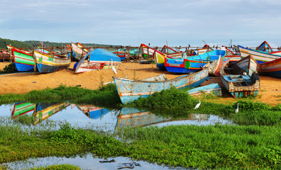 Fototapeta na wymiar Fishing boats at Vizhinjam harbor, Kovalam, Kerala, India