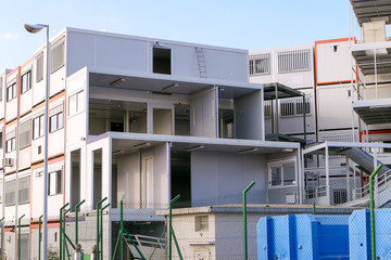 Prefabricated modular offices. Stacking of boxes for construction site.