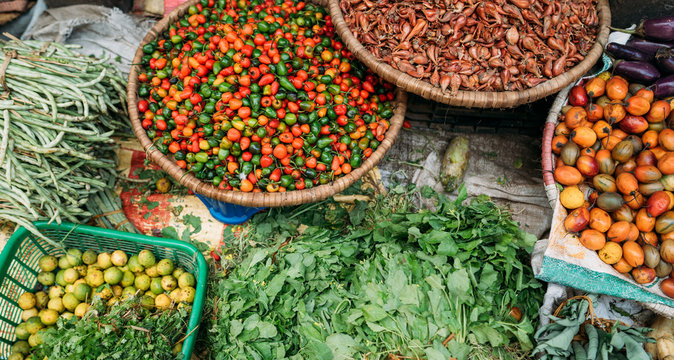 Street market still life top view image on the Kathmandu city, Nepal. Fresh vegetables and spices lying right on the path. Traditional Asian destinations traveling concept photo.