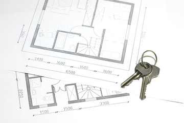 House keys on housing floor plans close-up