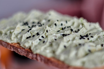 Healthy and fresh avocado as creme on a sliced bread.