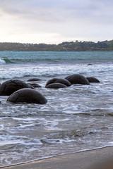 The huge boulders of Moeraki on the Pacific coast. South Island, New Zealand