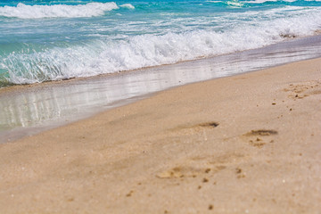 Footprints in the sand on the sea beach