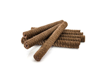 Sweet wafer rolls with filling isolated on a white background.
