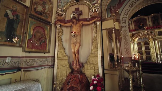 full-length statue of Jesus Christ in the Orthodox Church among the icons
