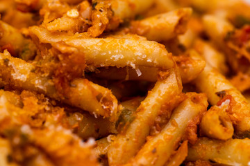 detail of macaroni with tomato sauce and grated cheese