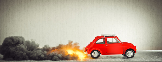 small compact vintage Italian car starts quickly making flames and smoke.