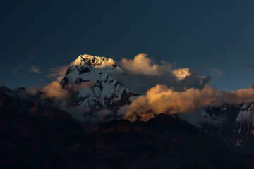 Landscape with Annapurna South peak view from Tadapani during trekking in Himalaya Mountains, Nepal