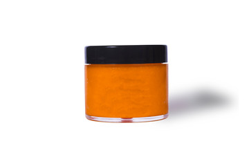 Natural fruit face mask. Container with a orange mask isolated on white background. - 349307391