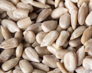 peeled sunflower seeds as background