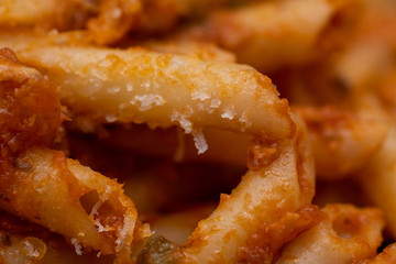 detail of macaroni with tomato sauce and grated cheese