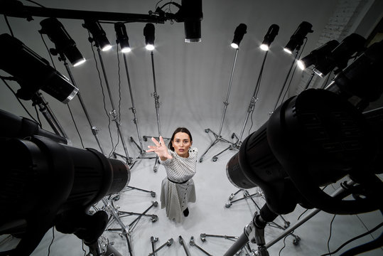 Portrait Of A Girl In A Photo Studio With Multiple Sources Of Pulsed Light