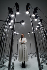 Portrait of a girl in a photo Studio with multiple sources of pulsed light