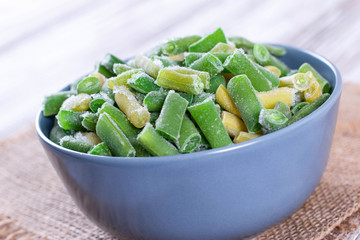 Frozen green beans in bowl