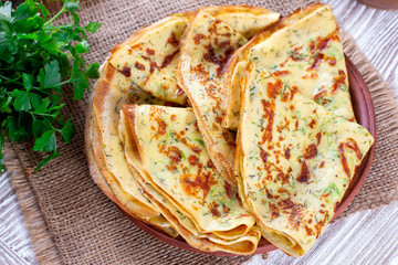 Thin pancakes with zucchini and cheese