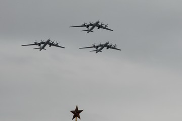 A group of turboprop strategic bombers Tu-95MS fly over Red Square in an air parade dedicated to the 75th anniversary of Victory Day