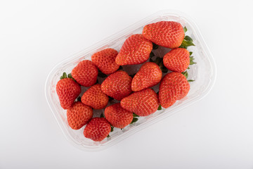 fresh strawberries in box isolated on white